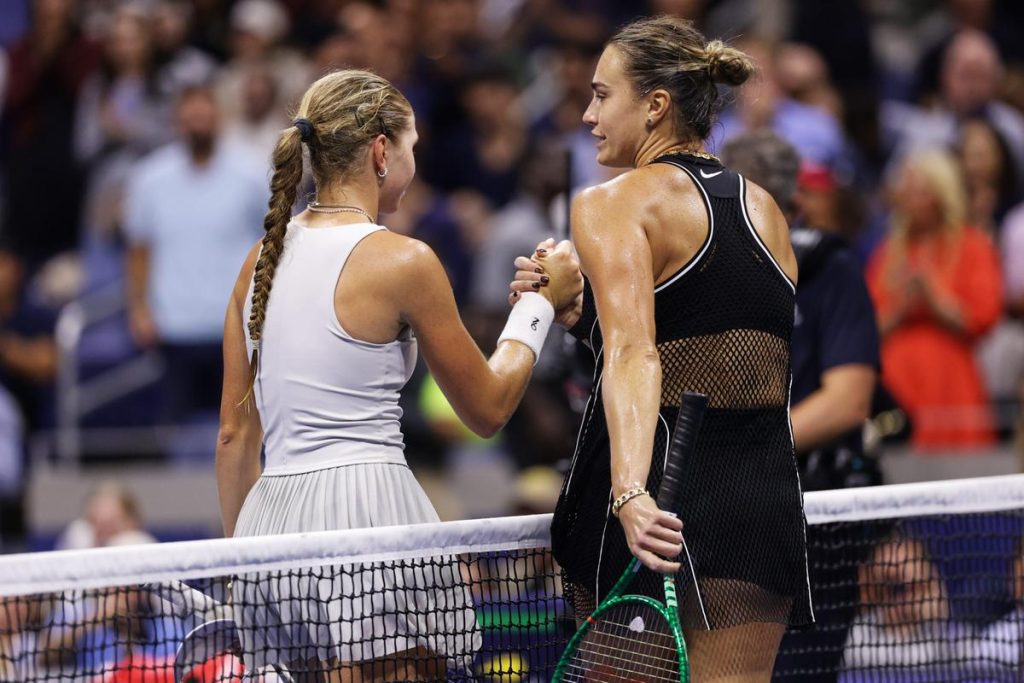 Polina Iatcenko, of Russia, left, and Aryna Sabalenka, of Belarus, meet at the net