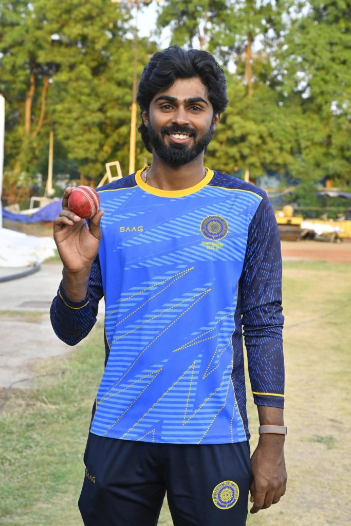 Hyderabad's Aniketh Reddy poses with the match ball after his five-wicket haul against Tripura