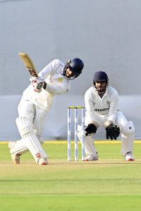 Manvanth Kumar of Karnataka in action against Saurashtra during the Ranji Trophy Elite cricket
