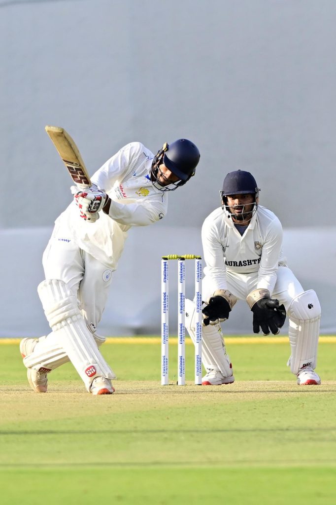 Manvanth Kumar of Karnataka in action against Saurashtra during the Ranji Trophy Elite cricket