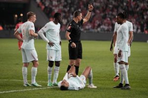 France's Kylian Mbappe lies on the ground after he scored and injured himself during the UEFA